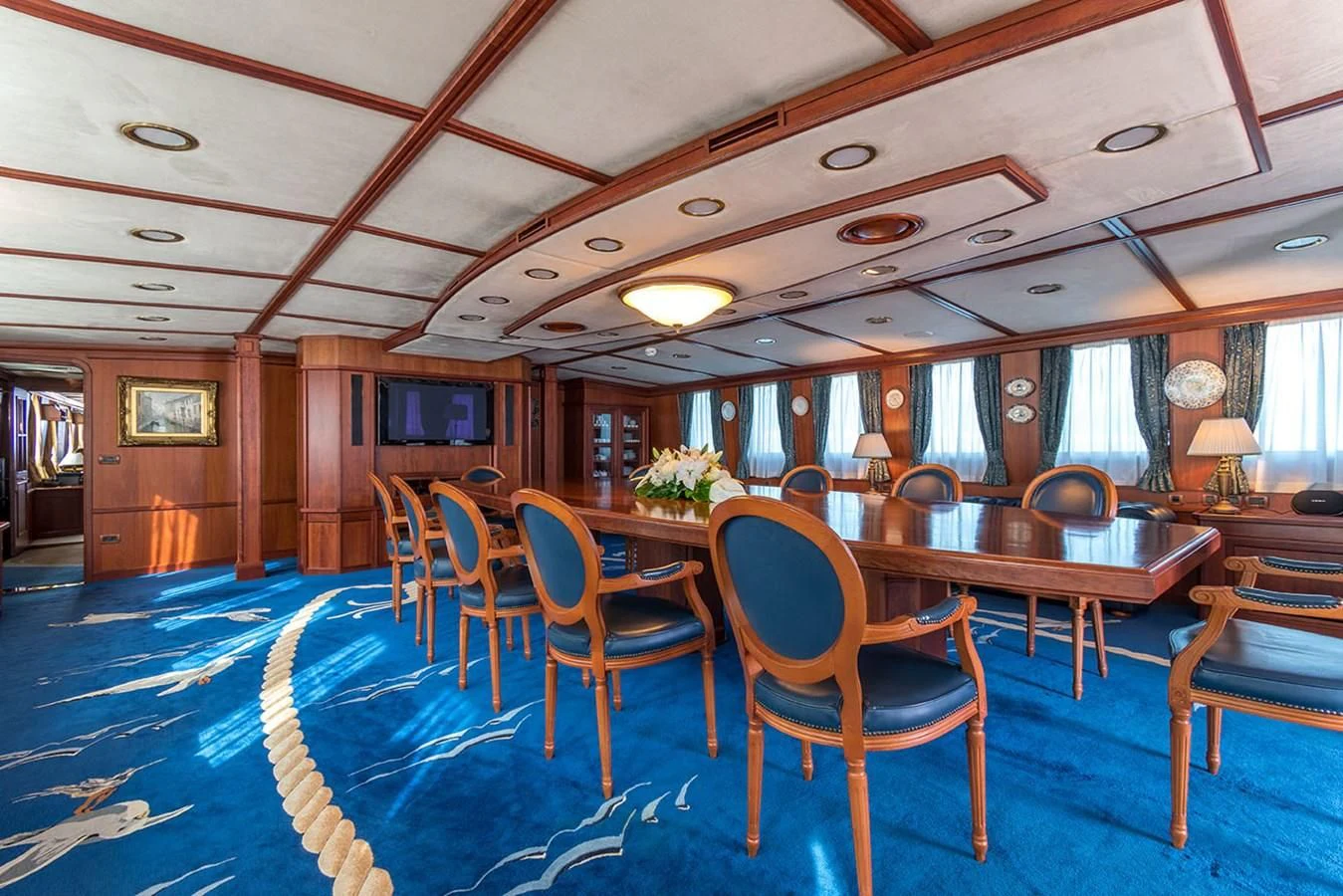 a large room with tables and chairs aboard SEAGULL II Yacht for Sale
