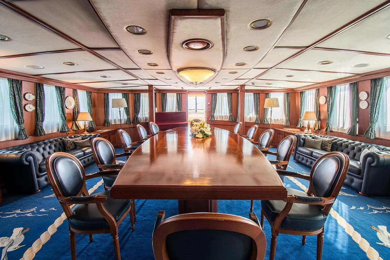 a room with tables and chairs aboard SEAGULL II Yacht for Sale
