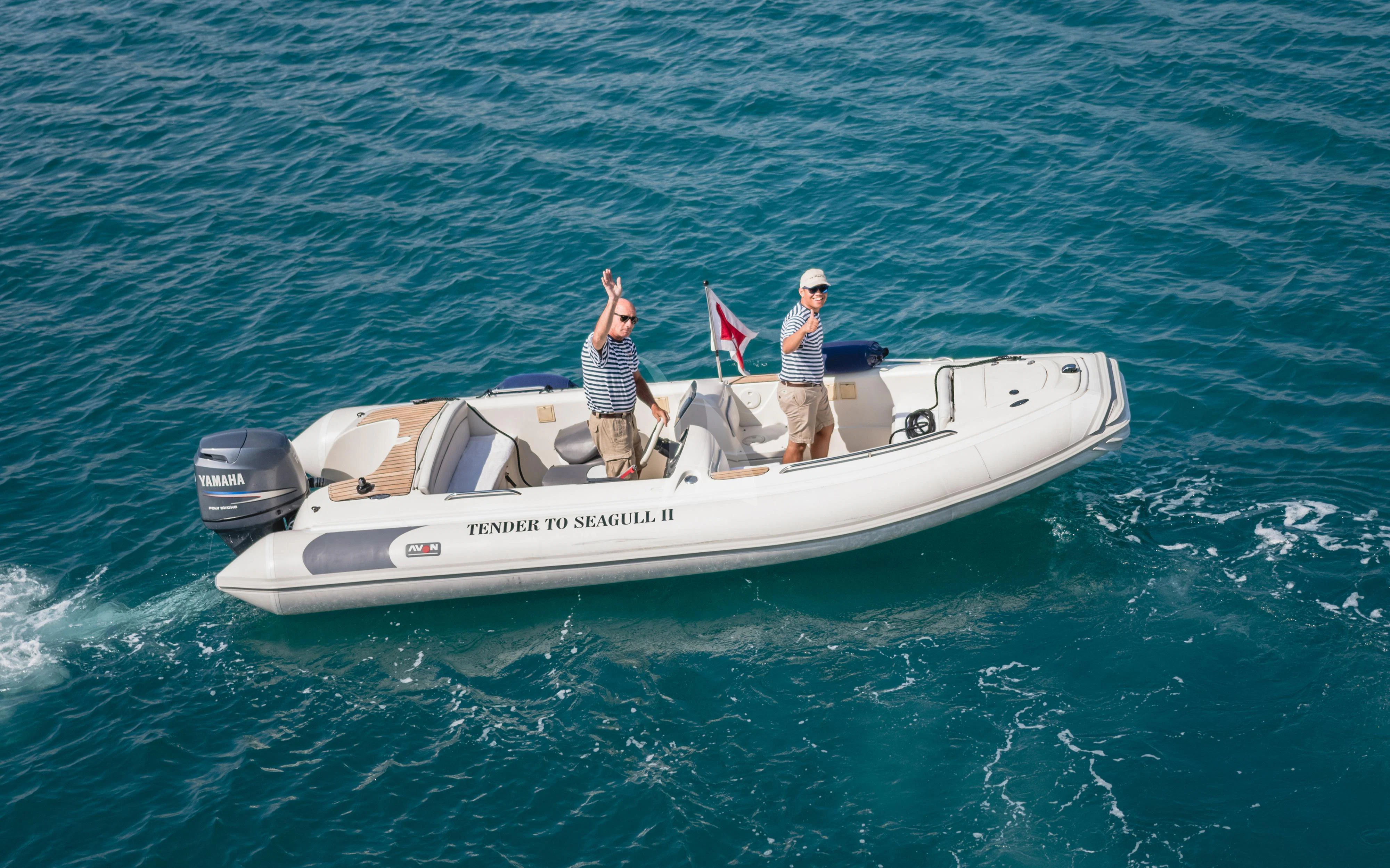 a man and a woman on a boat in the ocean aboard SEAGULL II Yacht for Sale