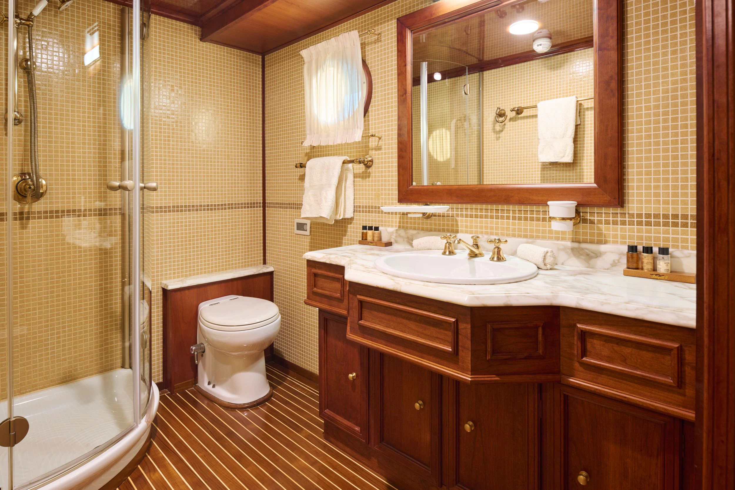 a bathroom with a sink and a toilet aboard SEAGULL II Yacht for Sale