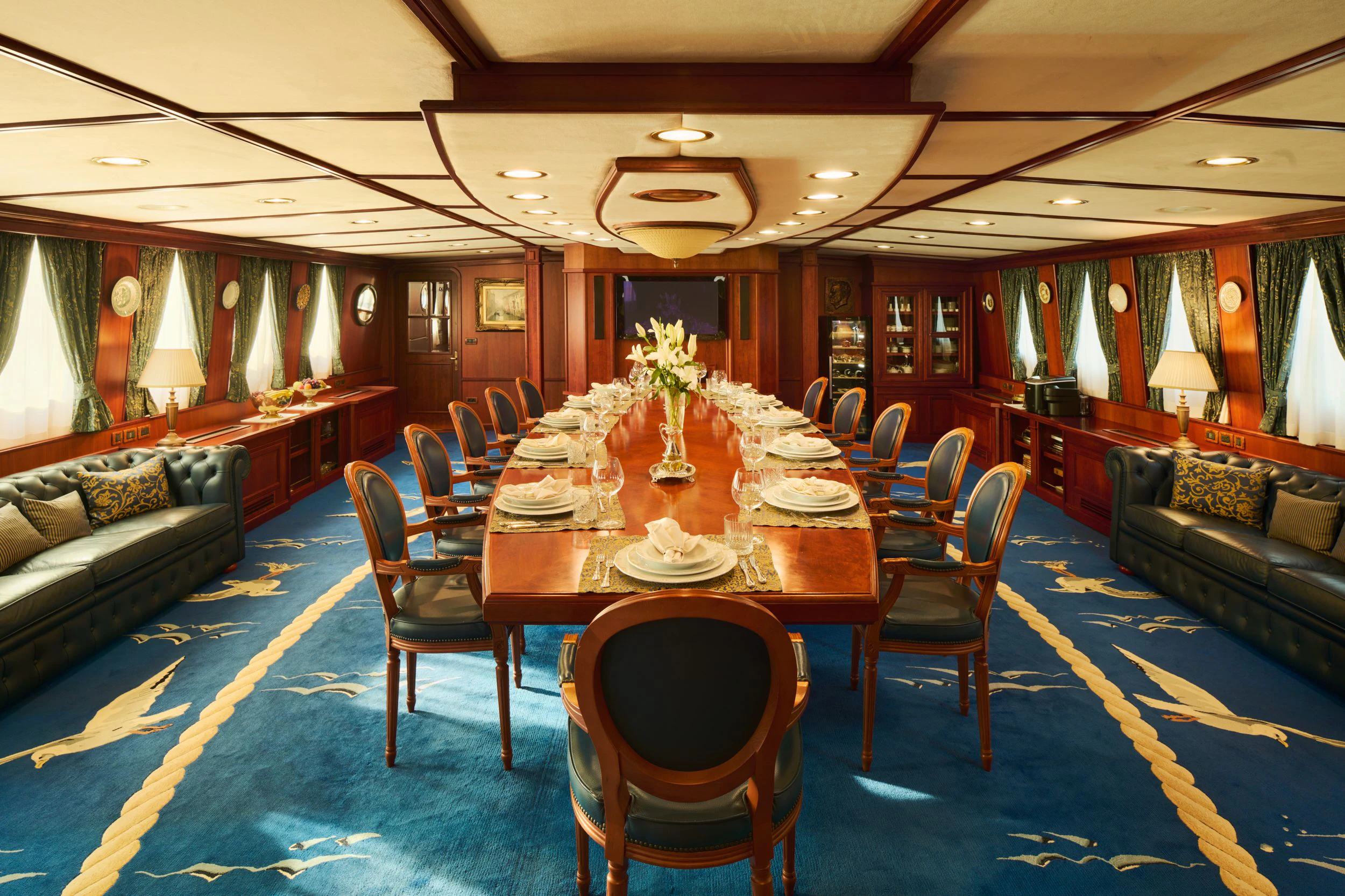 a dining room with a table and chairs aboard SEAGULL II Yacht for Sale