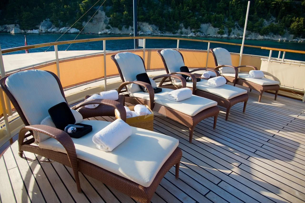 a deck with chairs and a laptop on it aboard SEAGULL II Yacht for Sale