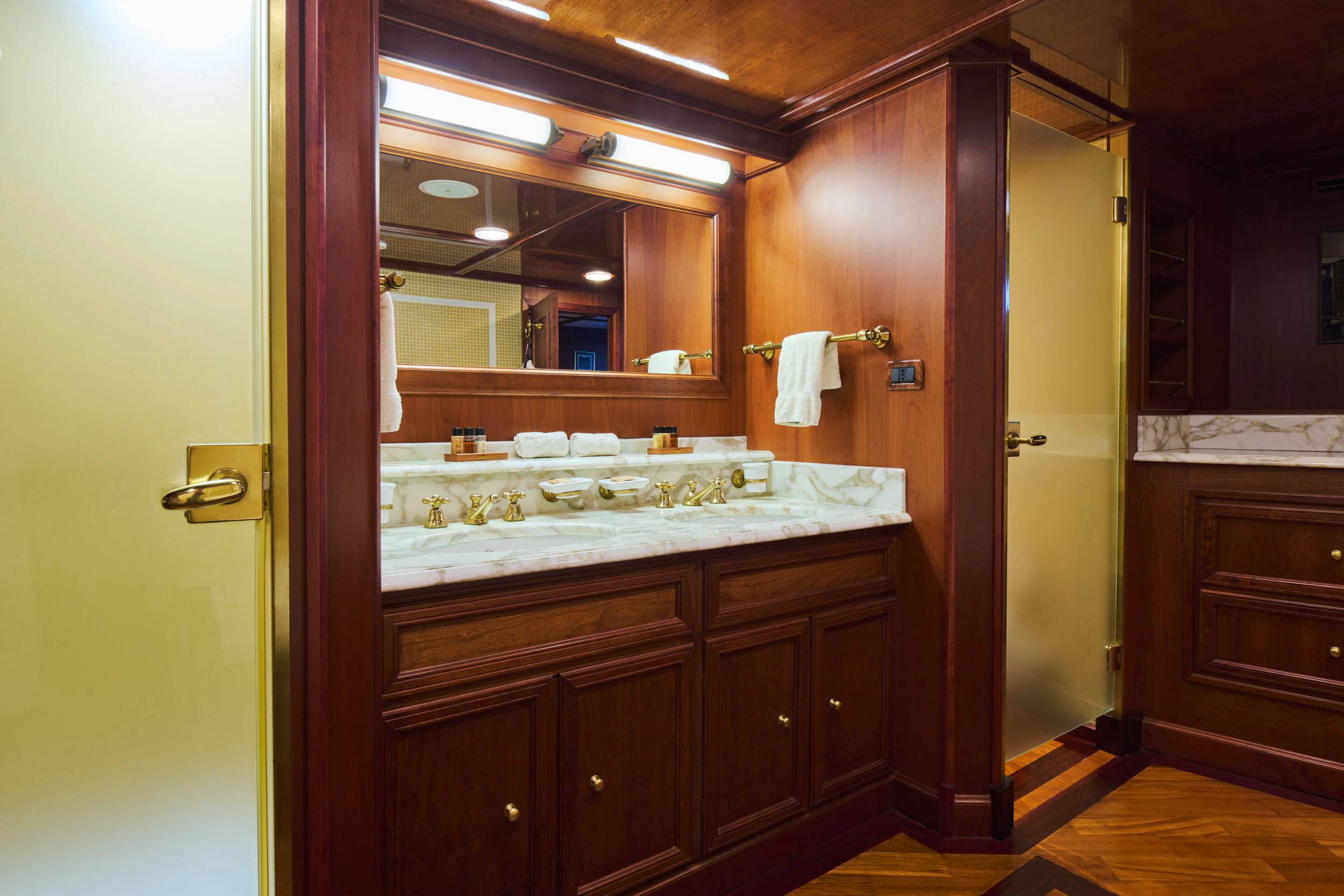 a bathroom with a countertop sink and a mirror aboard SEAGULL II Yacht for Sale