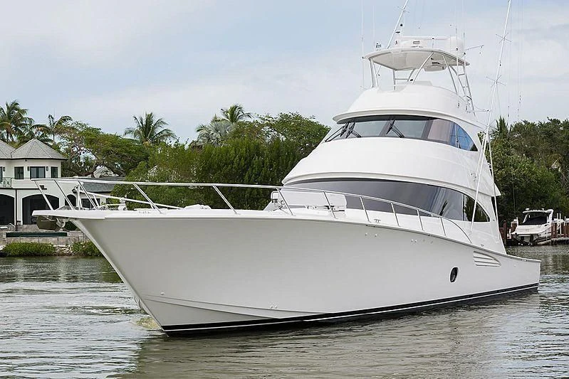 a white boat on the water aboard PARTY OF FIVE Yacht for Sale