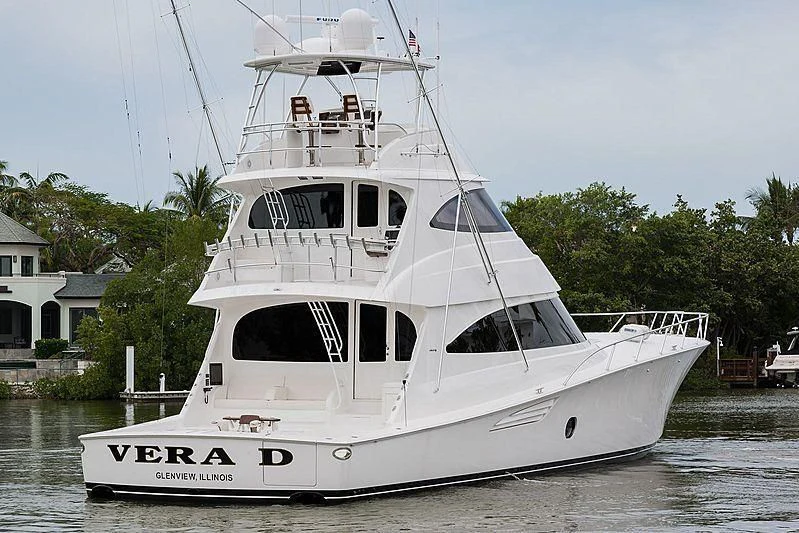 a white boat on the water aboard PARTY OF FIVE Yacht for Sale