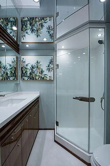 a bathroom with a glass shower aboard PARTY OF FIVE Yacht for Sale