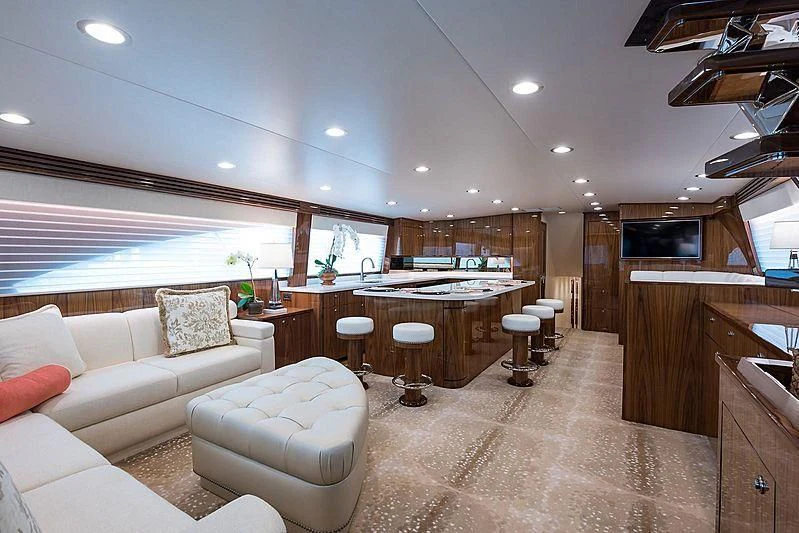 a living room with a couch and a table aboard PARTY OF FIVE Yacht for Sale