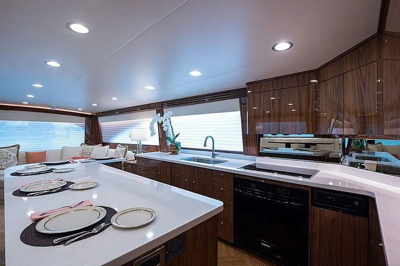 a kitchen with a large island aboard PARTY OF FIVE Yacht for Sale