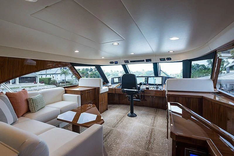 a large room with a couch and a table aboard PARTY OF FIVE Yacht for Sale