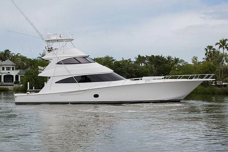 a white yacht on the water aboard PARTY OF FIVE Yacht for Sale
