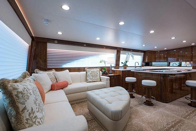 a living room with a couch and a table aboard PARTY OF FIVE Yacht for Sale