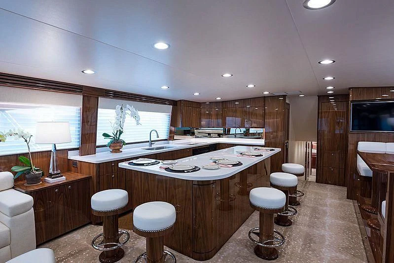 a kitchen with a large island aboard PARTY OF FIVE Yacht for Sale