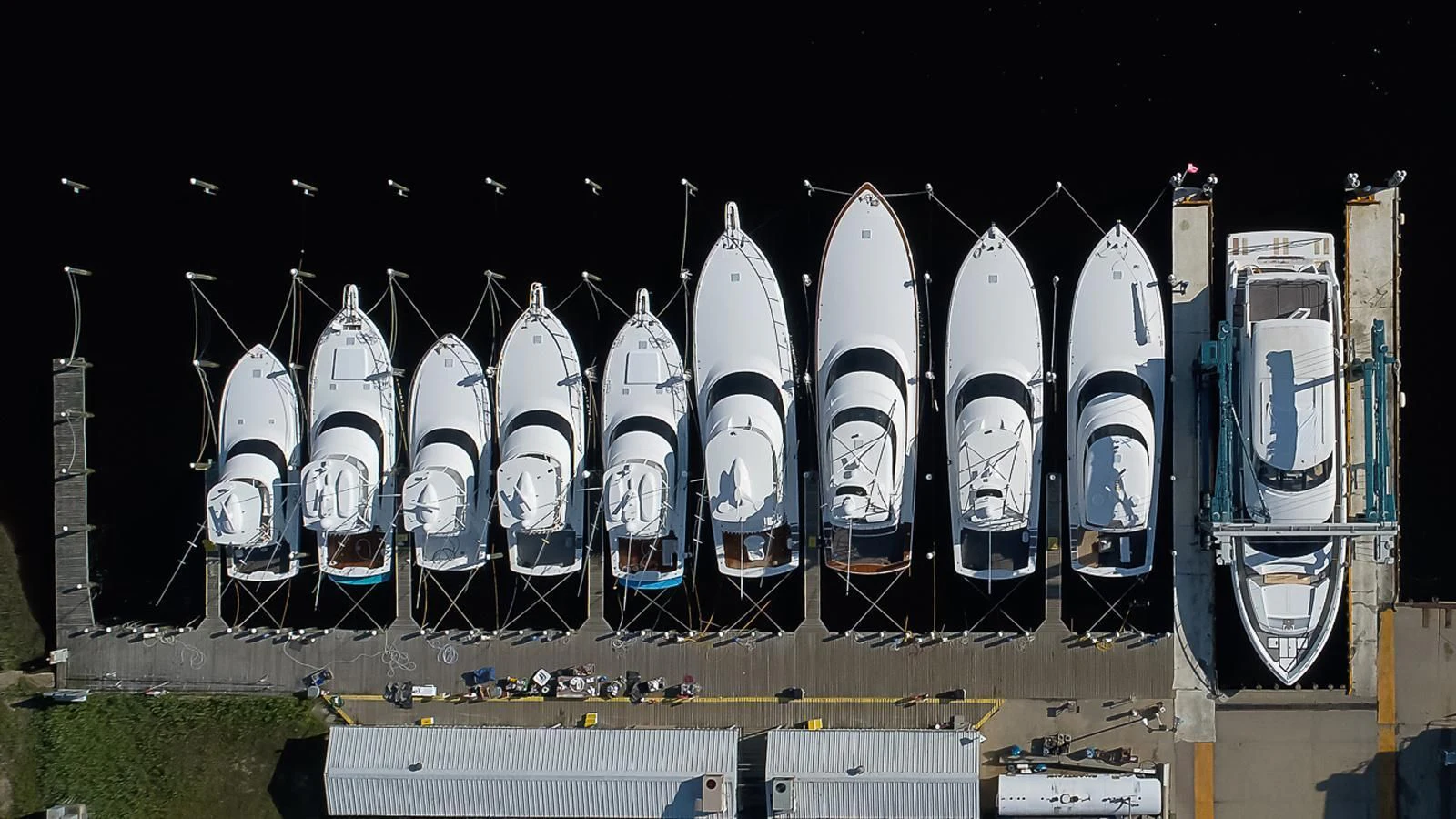 a row of white surfboards aboard OBSESSION Yacht for Sale