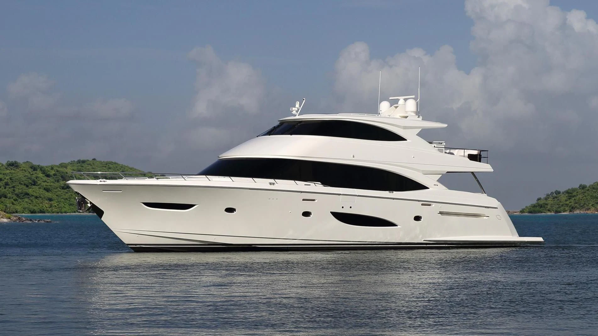 a white yacht on the water aboard OBSESSION Yacht for Sale