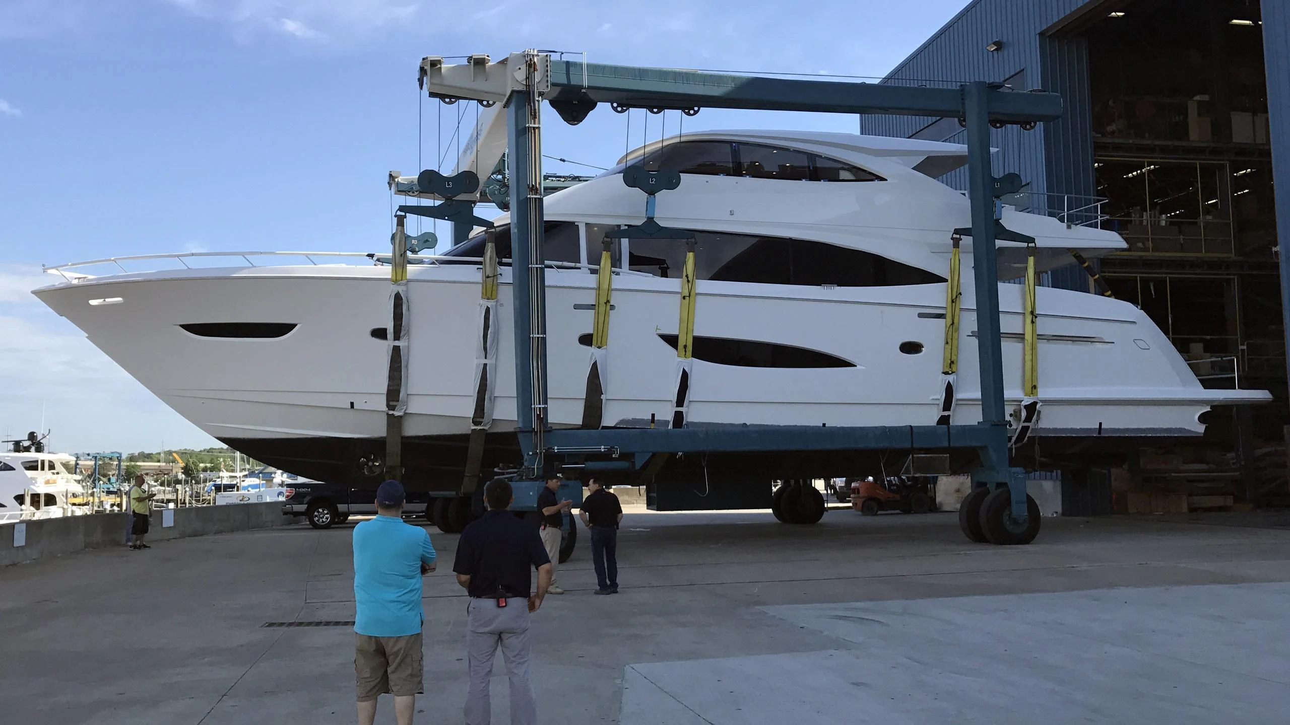 a group of people standing next to a military plane aboard OBSESSION Yacht for Sale