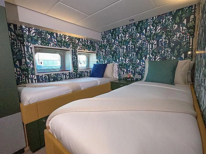 a couple of beds in a room aboard BAD COMPANY SUPPORT Yacht for Charter