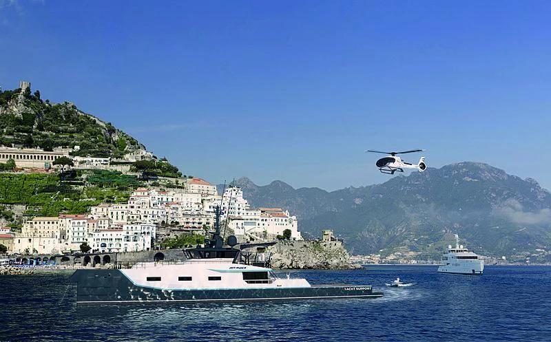 a helicopter flying over a body of water aboard BAD COMPANY SUPPORT Yacht for Charter
