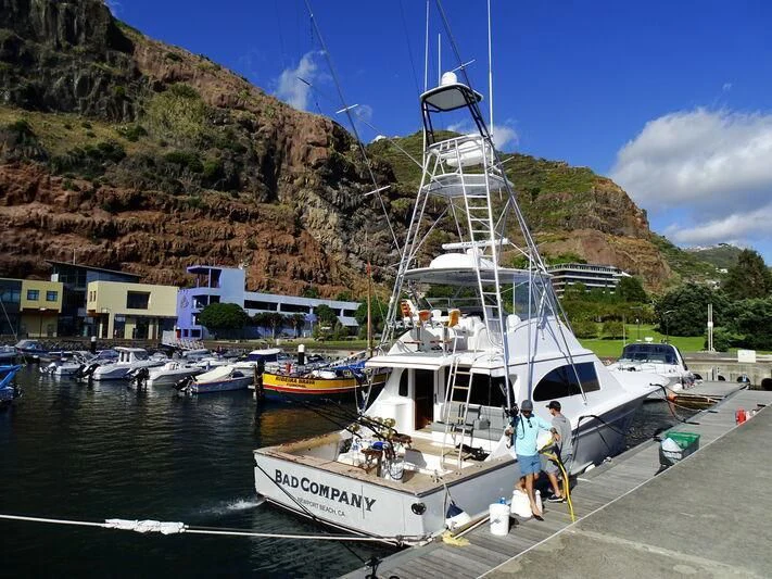 a boat docked at a pier aboard BAD COMPANY SUPPORT Yacht for Charter