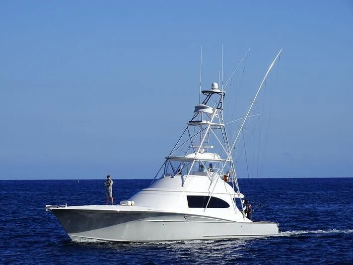 a white boat in the water aboard BAD COMPANY SUPPORT Yacht for Charter