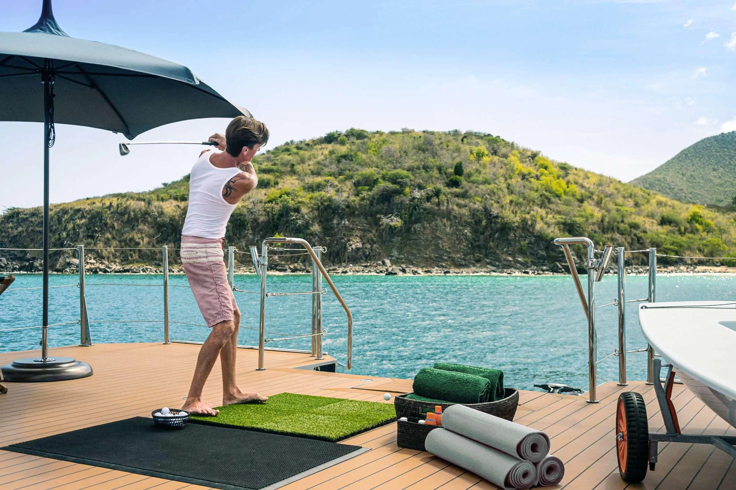 a couple of boys playing on a table by the water aboard BAD COMPANY SUPPORT Yacht for Charter