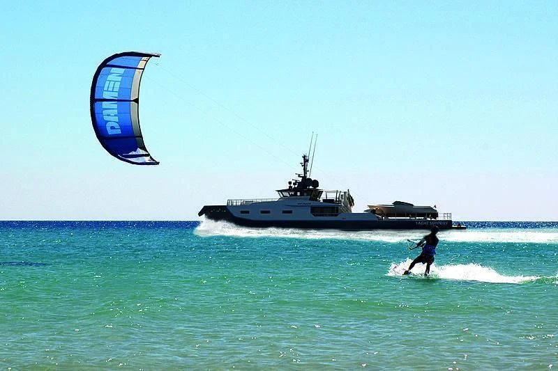 a person parasailing on a boat aboard BAD COMPANY SUPPORT Yacht for Charter