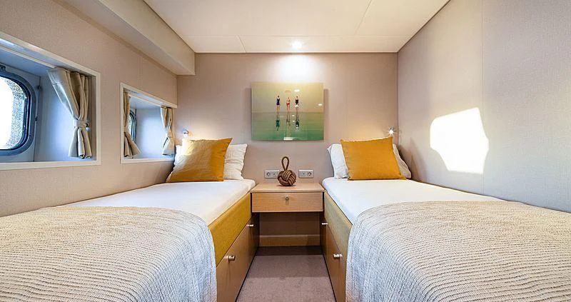 a couple of beds in a room aboard BAD COMPANY SUPPORT Yacht for Charter