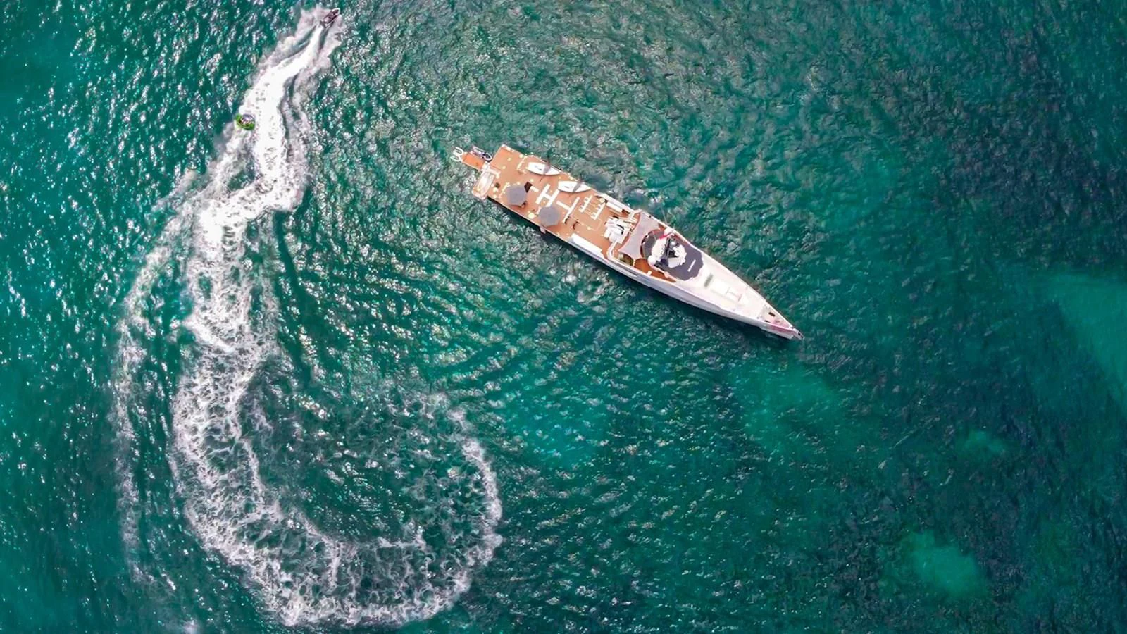 a small boat in the water aboard BAD COMPANY SUPPORT Yacht for Charter