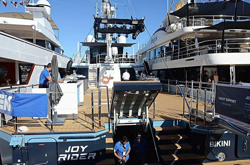 a boat docked with several boats aboard BAD COMPANY SUPPORT Yacht for Charter