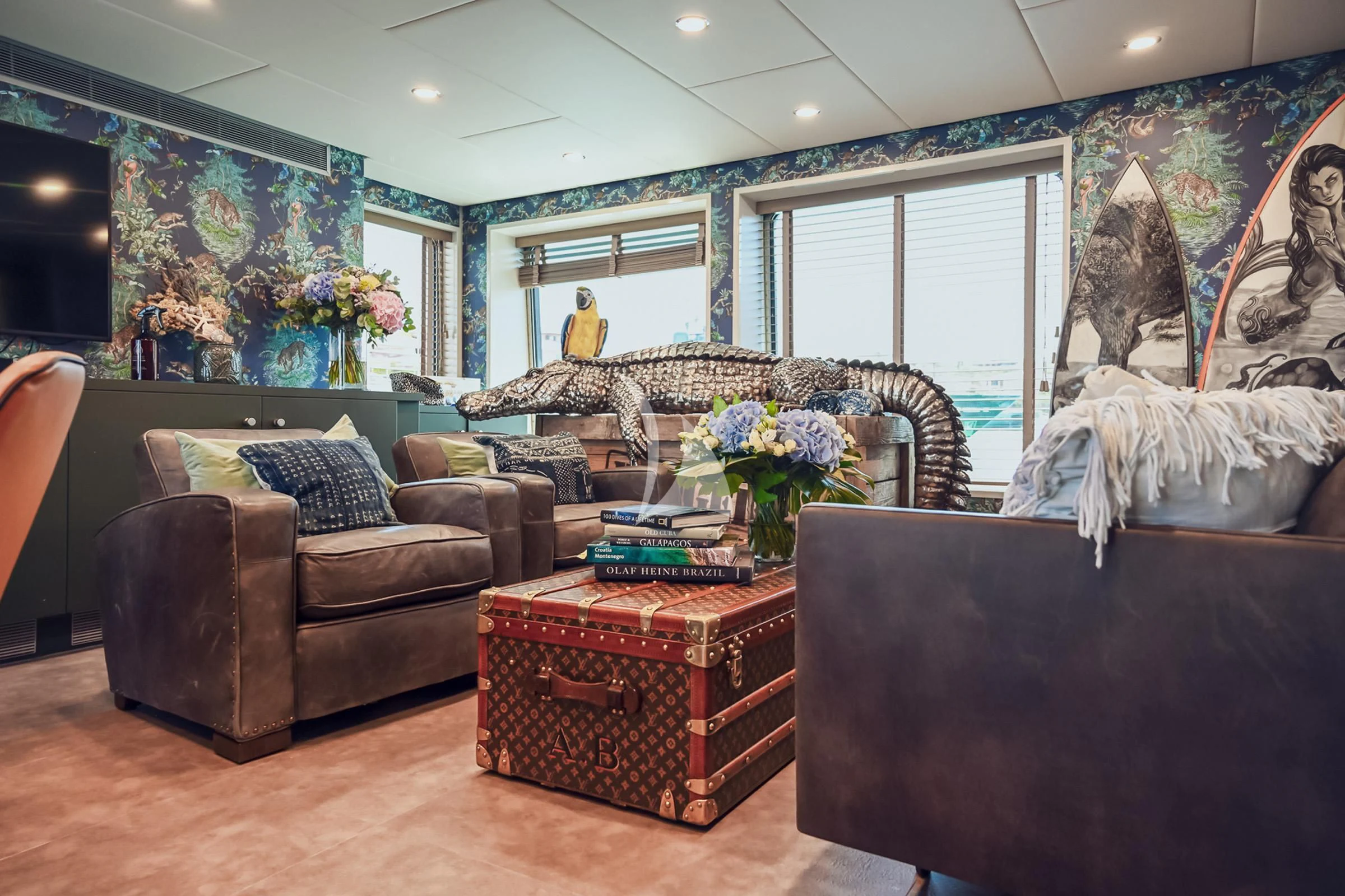 a living room with a large window aboard BAD COMPANY SUPPORT Yacht for Charter