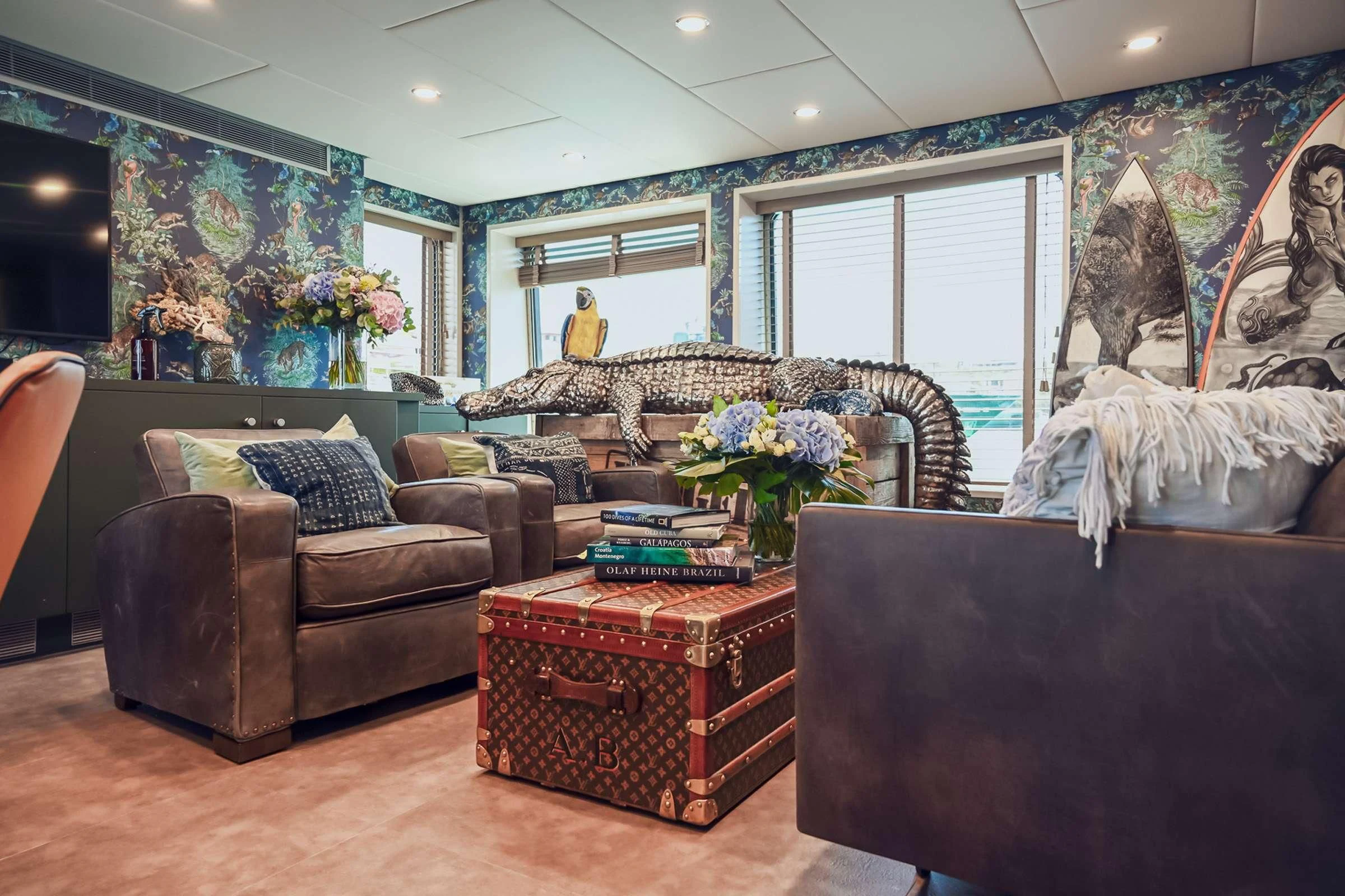 a living room with a large window aboard BAD COMPANY SUPPORT Yacht for Charter