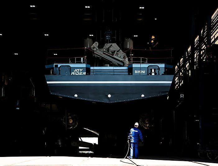 a person standing on a stage aboard BAD COMPANY SUPPORT Yacht for Charter