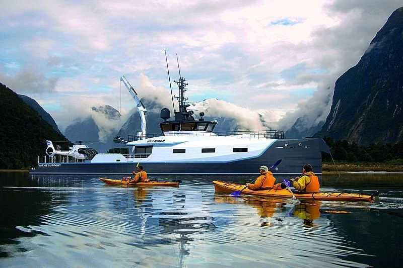 a group of people kayaking in a lake aboard BAD COMPANY SUPPORT Yacht for Charter