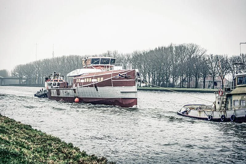 a couple of boats are parked in the water aboard BAD COMPANY SUPPORT Yacht for Charter