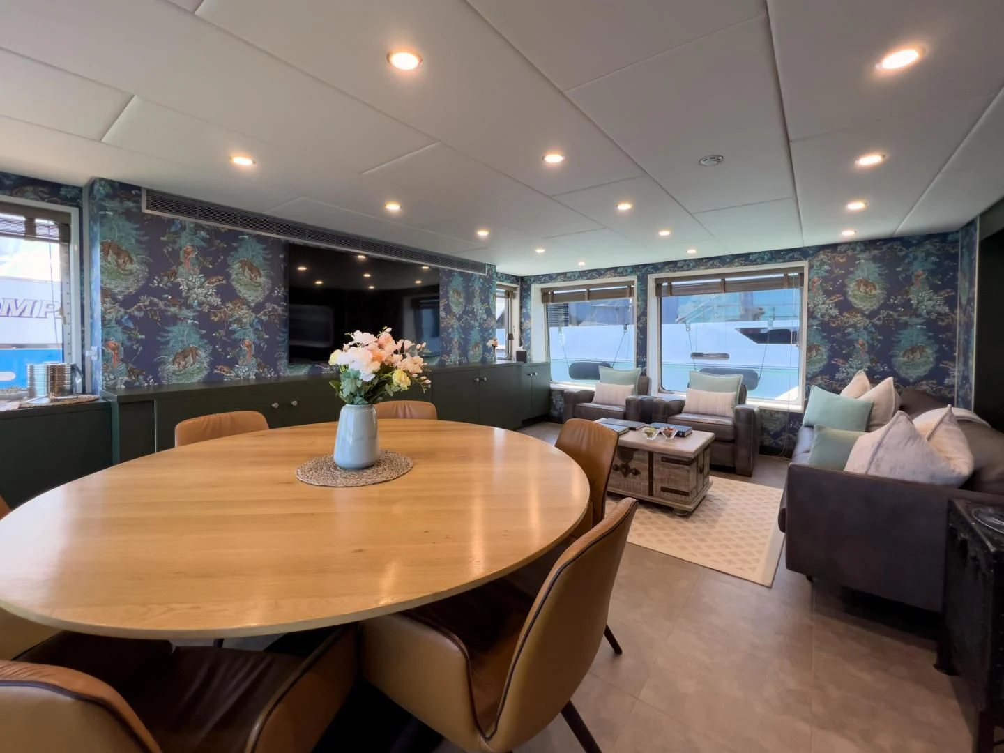 a dining room with a table and chairs aboard BAD COMPANY SUPPORT Yacht for Charter