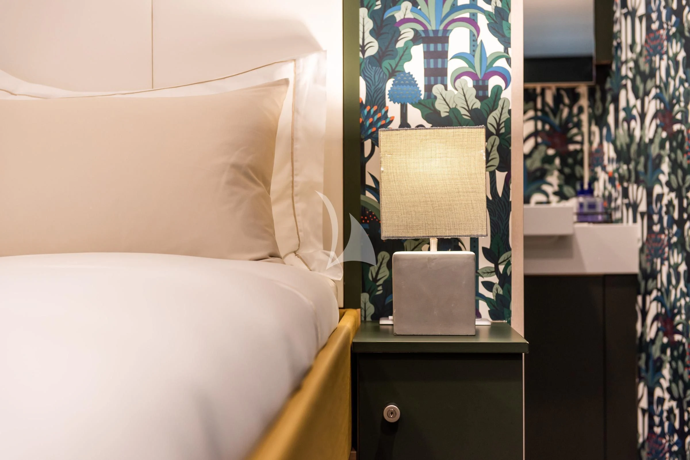 a lamp on a bed aboard BAD COMPANY SUPPORT Yacht for Charter