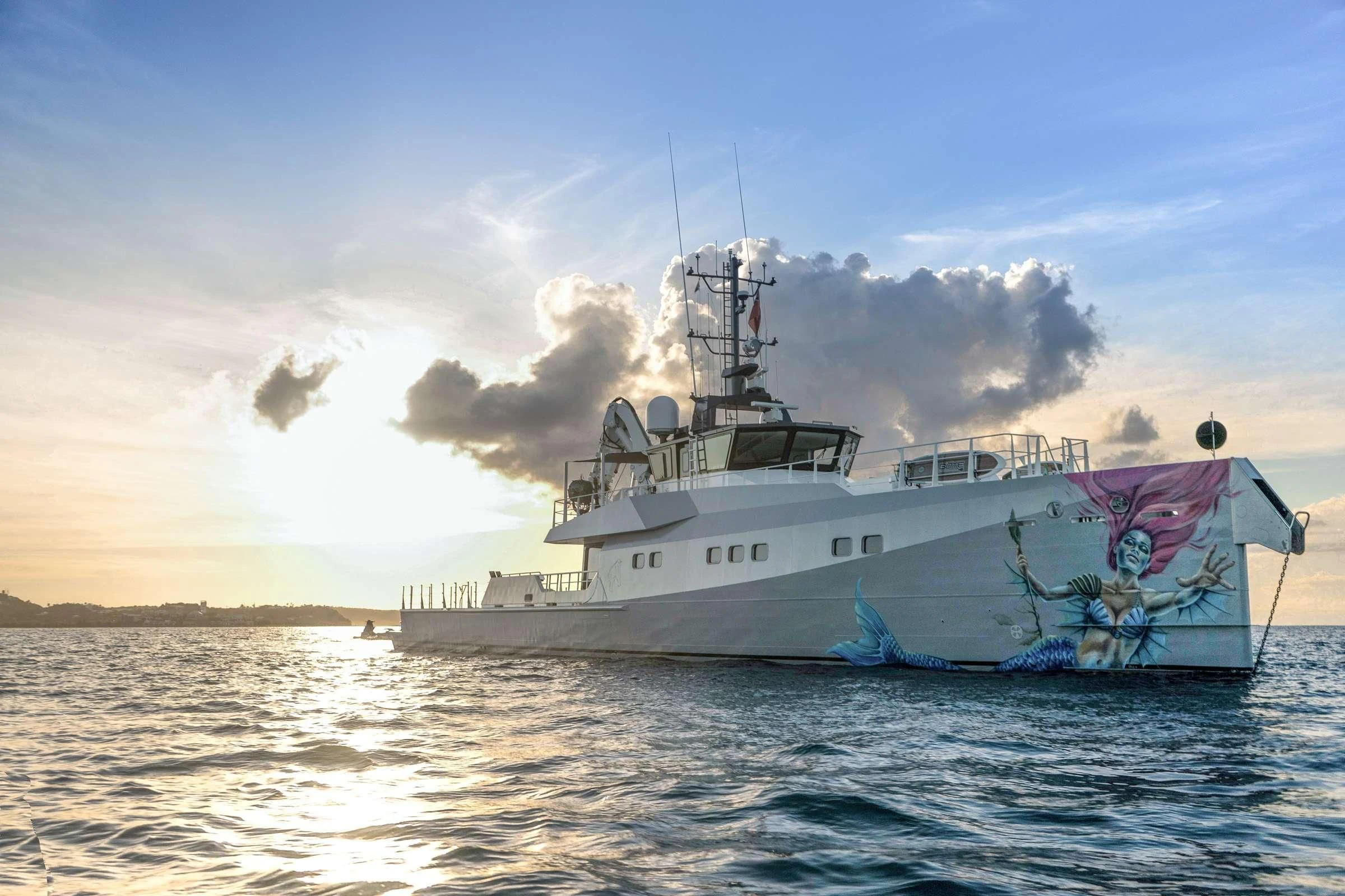 a large ship in the water aboard BAD COMPANY SUPPORT Yacht for Charter