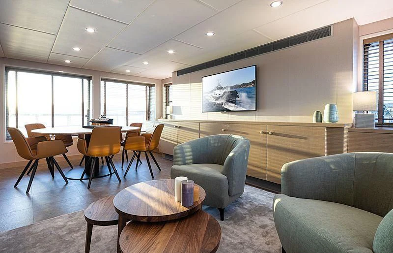 a living room with a couch and a table aboard BAD COMPANY SUPPORT Yacht for Charter