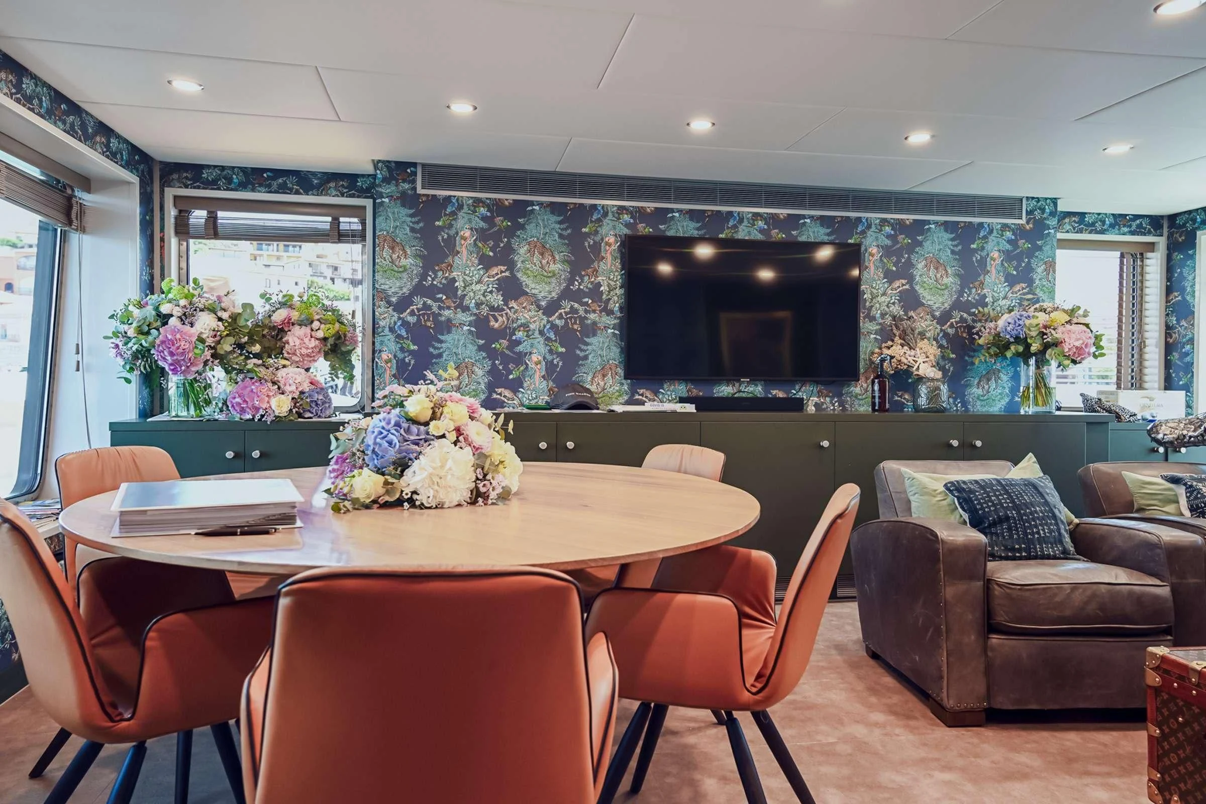 a room with a table and chairs aboard BAD COMPANY SUPPORT Yacht for Charter