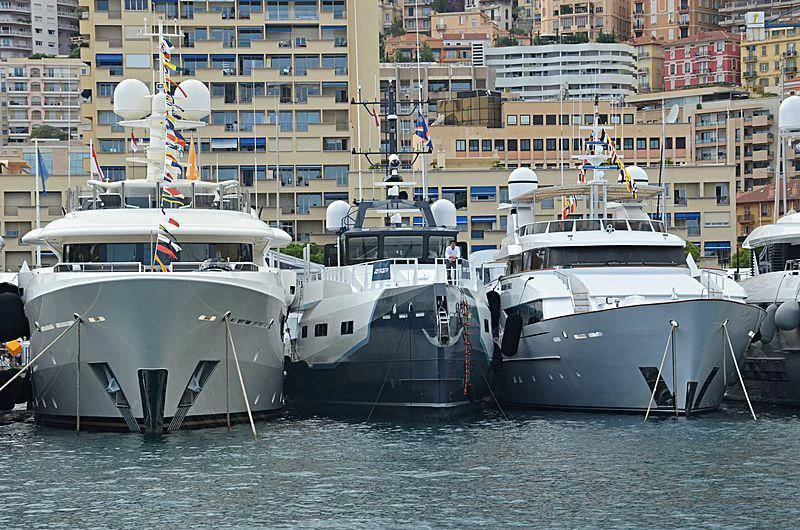 several boats docked at a pier aboard BAD COMPANY SUPPORT Yacht for Charter