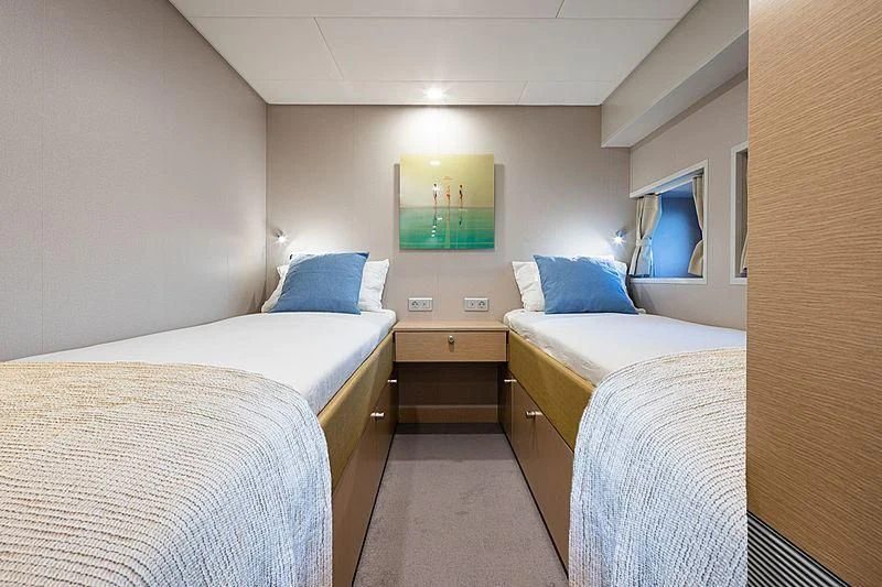 a room with two beds aboard BAD COMPANY SUPPORT Yacht for Charter