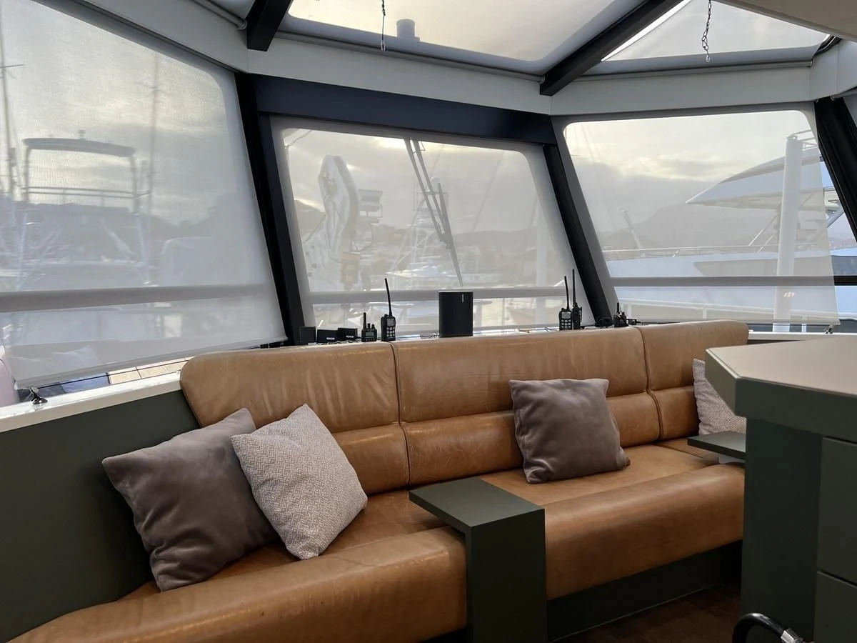 a couch in a room aboard BAD COMPANY SUPPORT Yacht for Charter
