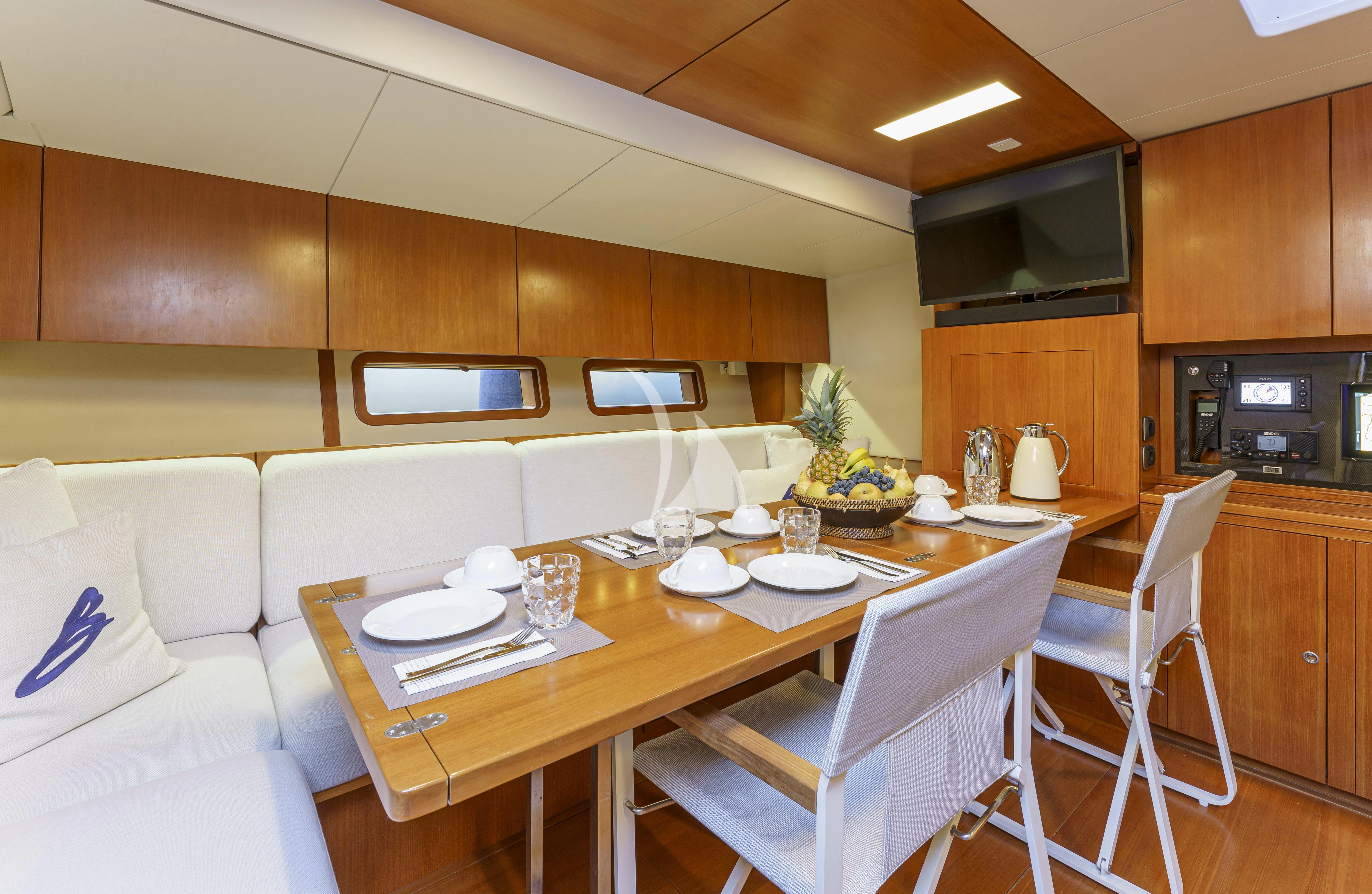 a kitchen and dining area aboard BOMBARDA Yacht for Sale