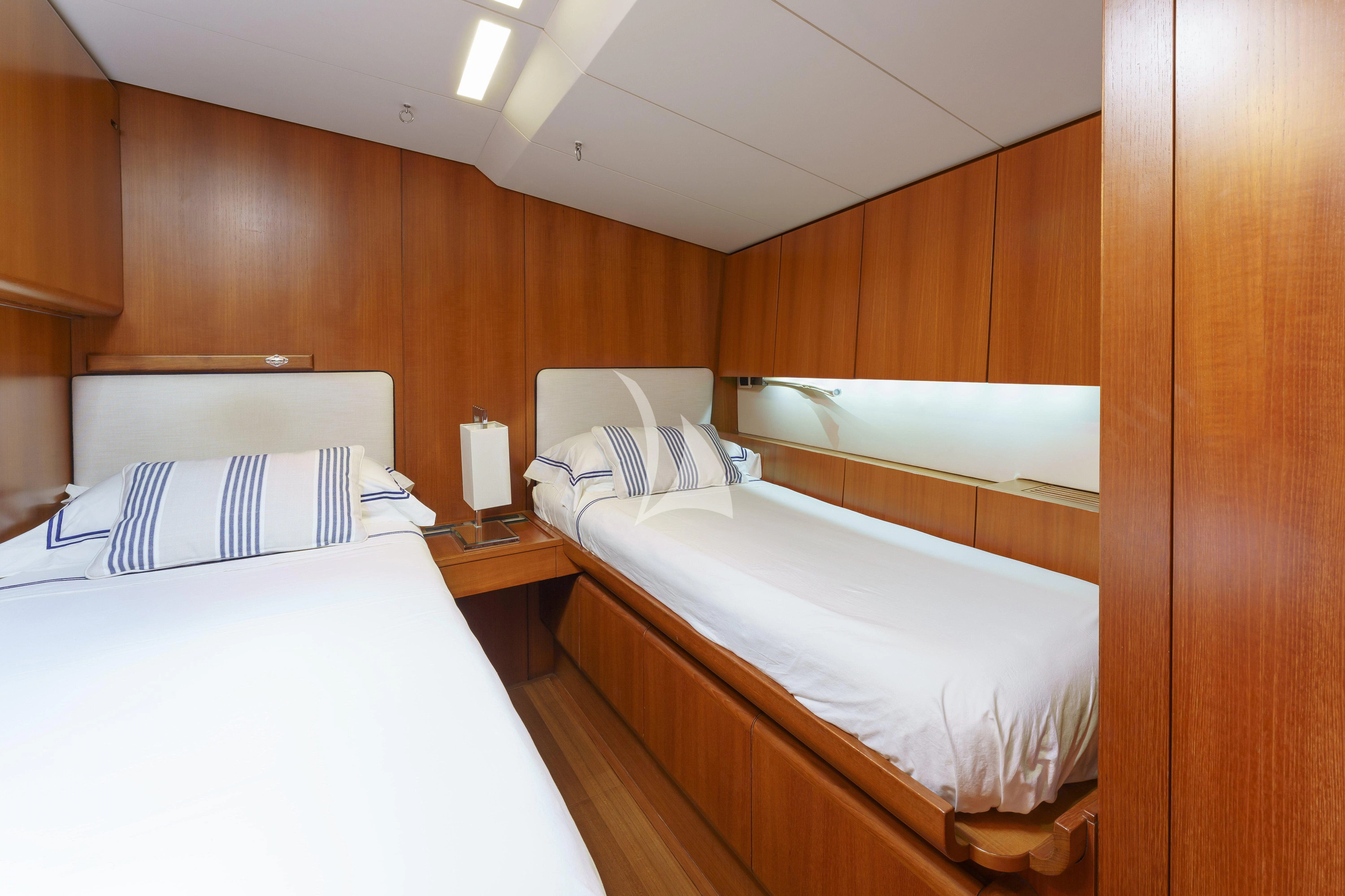 a room with two beds aboard BOMBARDA Yacht for Sale