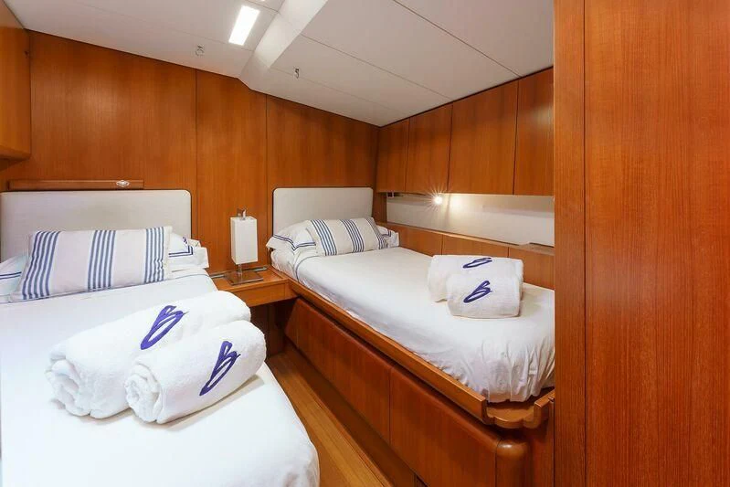a room with two beds aboard BOMBARDA Yacht for Sale