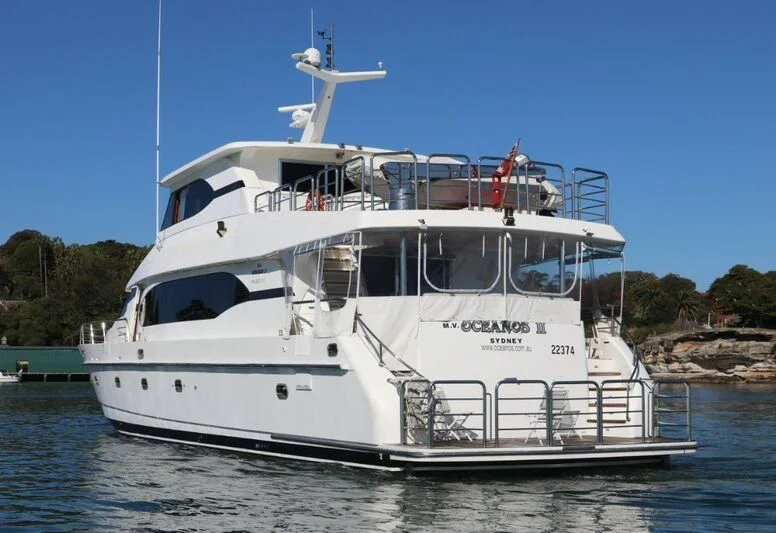 a white boat with a drone on top of it aboard SALT II Yacht for Sale