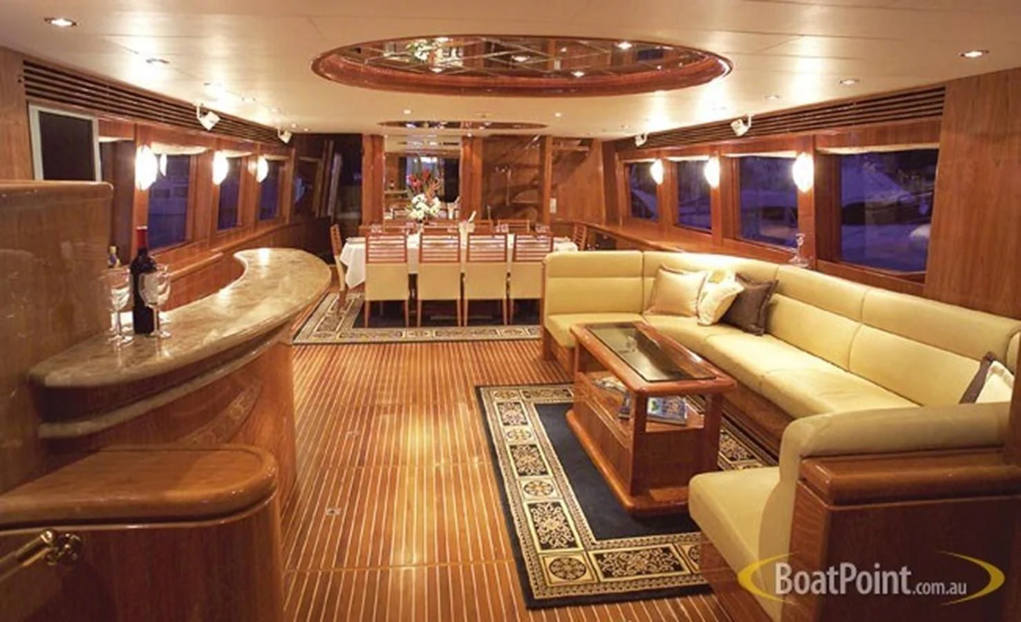 a room with a couch and a table and chairs aboard SALT II Yacht for Sale