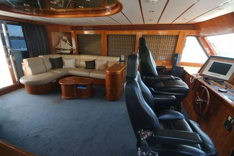 a living room with a couch and a table aboard SALT II Yacht for Sale