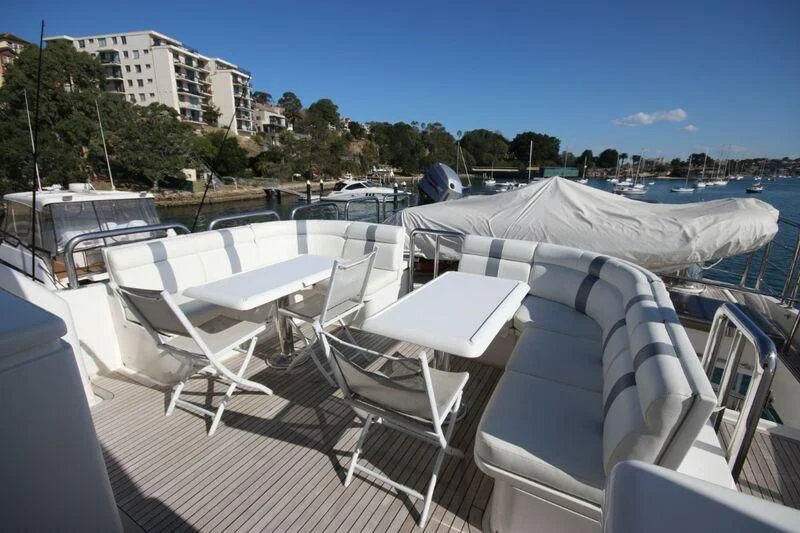 a deck with chairs and umbrellas aboard SALT II Yacht for Sale
