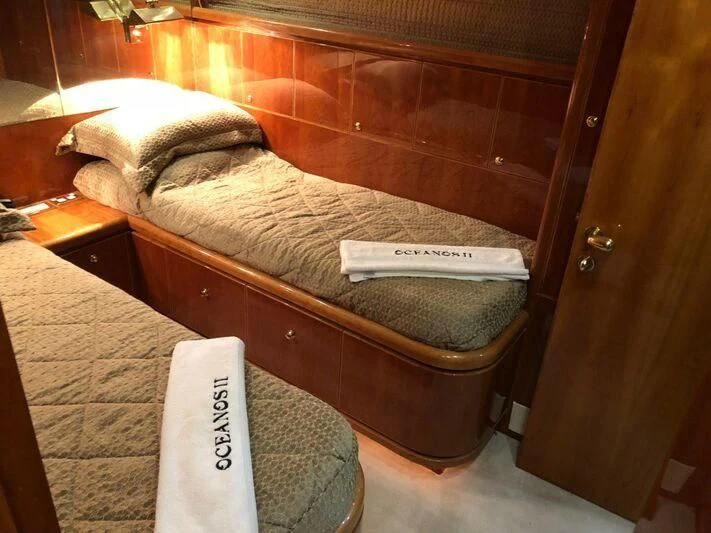 a bed with a towel on it aboard SALT II Yacht for Sale