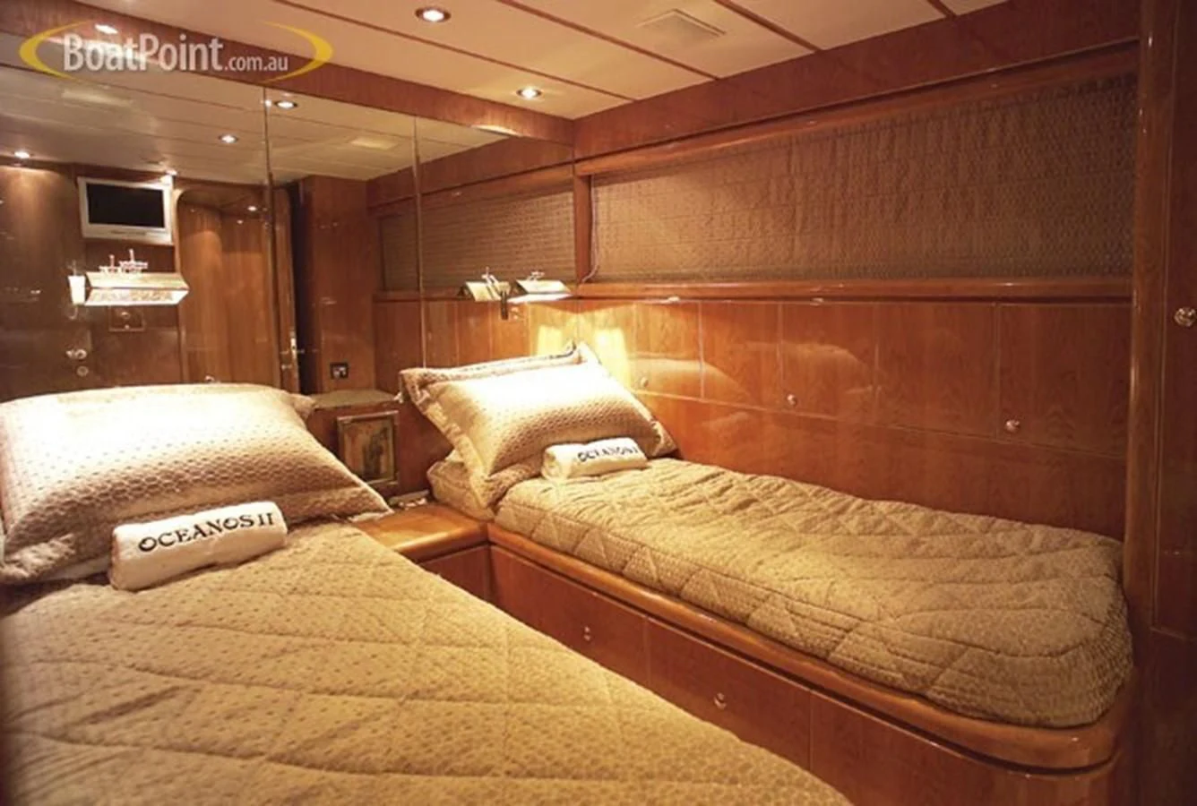 a room with beds and a wood wall aboard SALT II Yacht for Sale